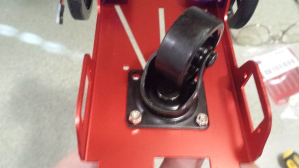 Position and attach Front Caster
